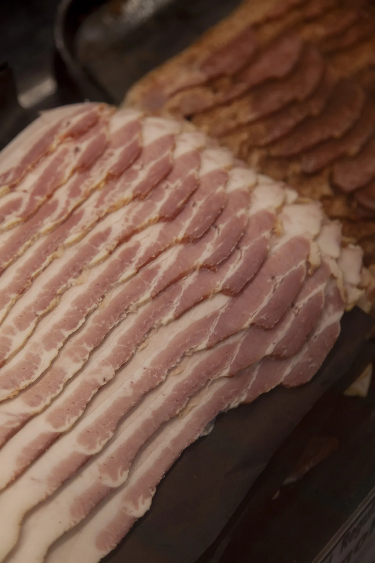 Sliced raw bacon at D.W. Whitaker Meats